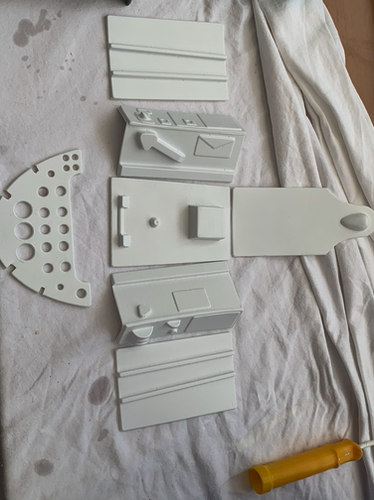 The ABS parts for the cockpit cut from their mounting sheet